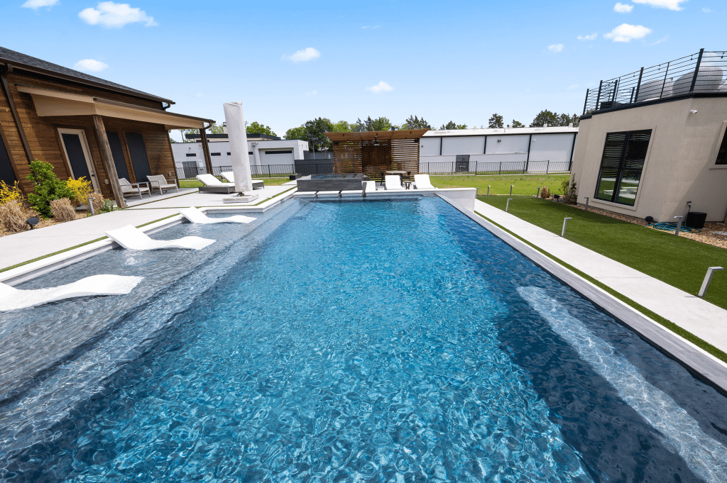 Geometric pool with sun loungers.