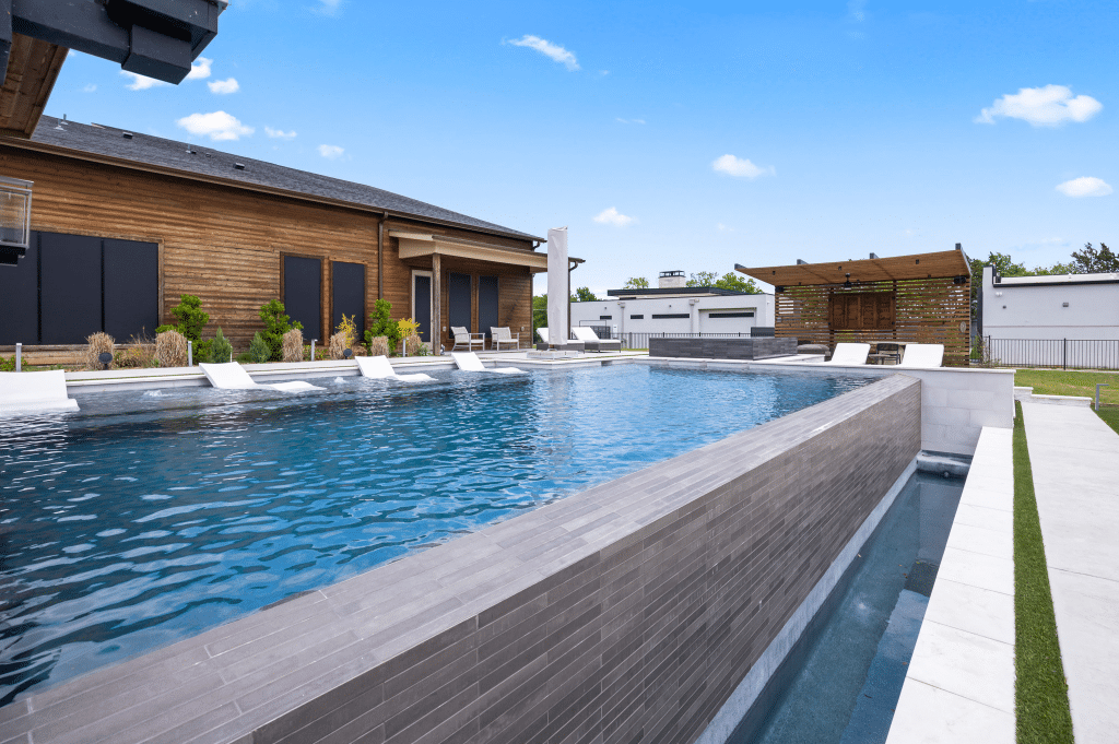 Geometric pool with sun loungers.