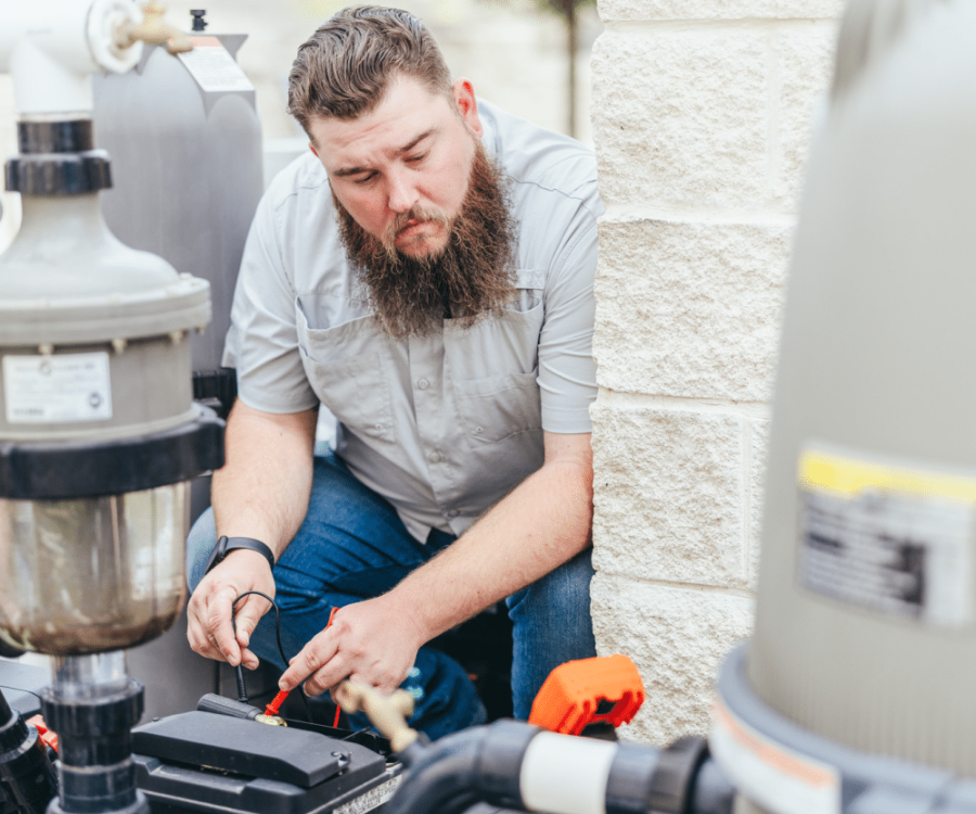 Image Wrapper1 Man working on pool system.